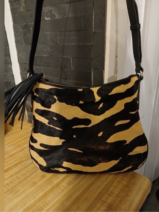 henri bendel Handbags - Henri Bendel- Black and Tan Animal-Print Calf Hair Shoulder Bag with Tassel